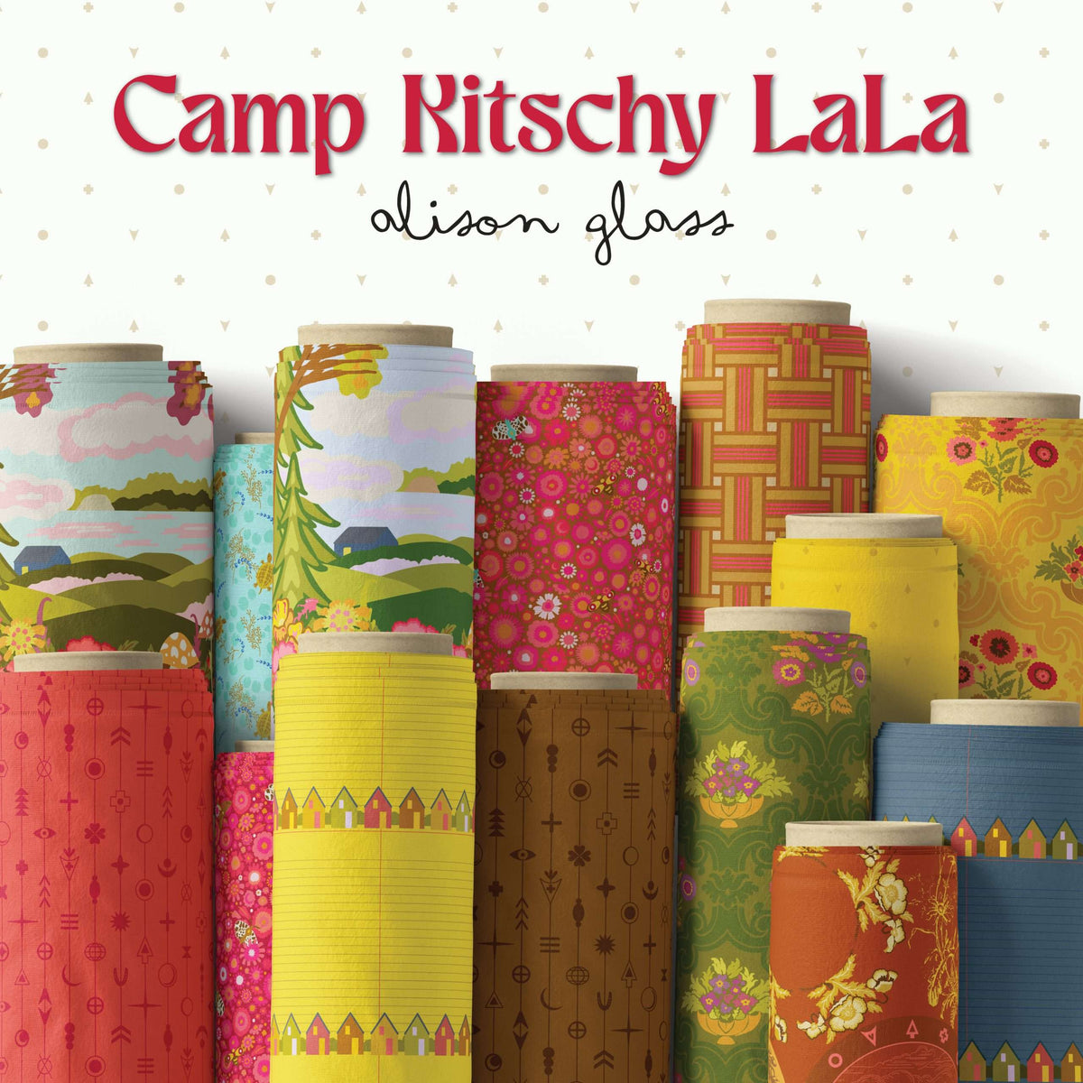 photo showing the design on fabric, cotton reels in blue green and yellow on a grey background